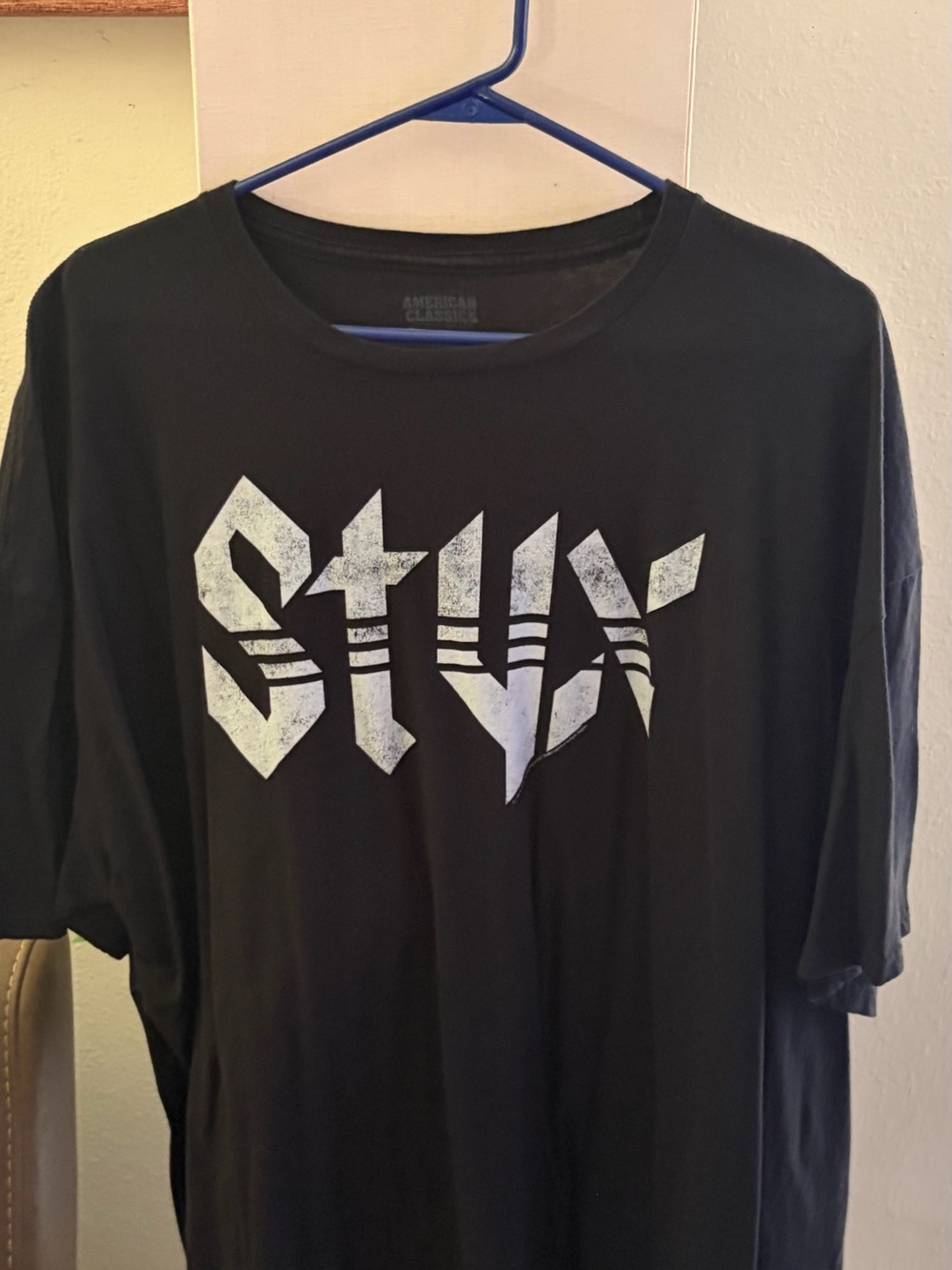 Black Short-Sleeve Graphic Tee with White Distressed Logo